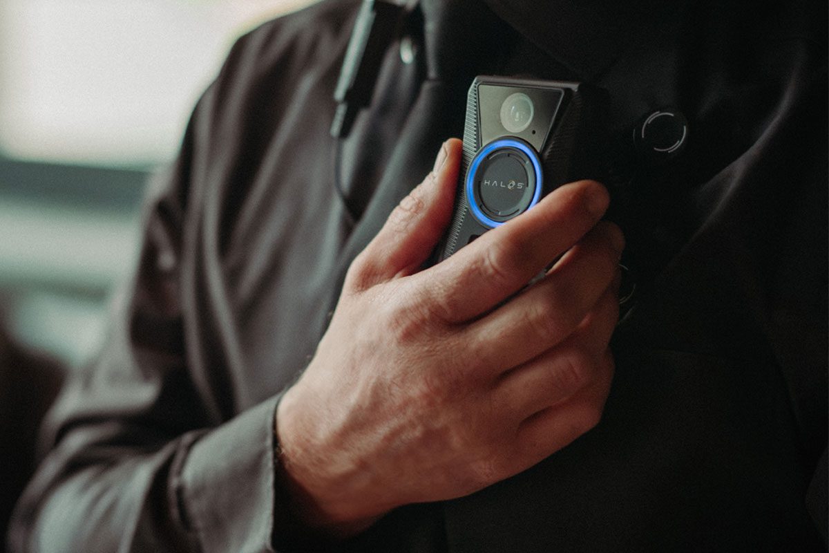A man with a HALOS bodycamera attached to the his chest.