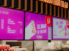 Henderson Technology reaches installation milestone Digital screens inside a convenience store highlighting a food-to-go section from Henderson Technology.