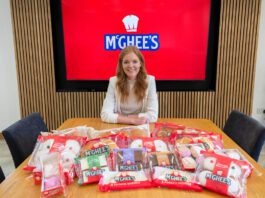 McGhee’s rises to the top in Worldpanel research Aisling McGhee, commercial director at McGhee's, sits at a boardroom table with McGhee's products across the table.