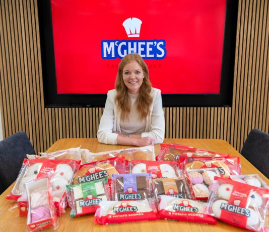 McGhee’s rises to the top in Worldpanel research Aisling McGhee, commercial director at McGhee's, sits at a boardroom table with McGhee's products across the table.