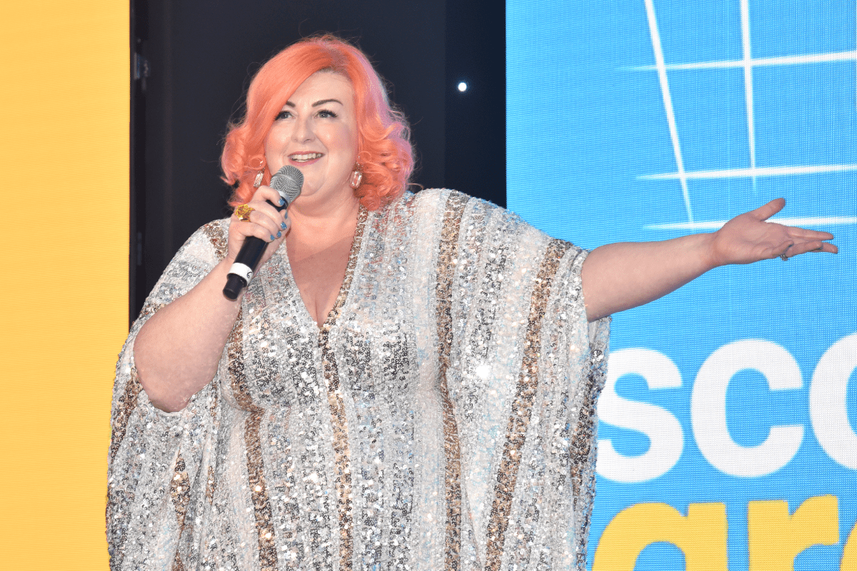 Michelle McManus stands on the stage at the Scottish Grocer Awards 2025.