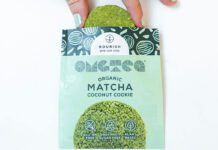Nourish unveils new Matcha Coconut Cookies A person pulls a Nourish Matcha Coconut Cookie out form its packet.