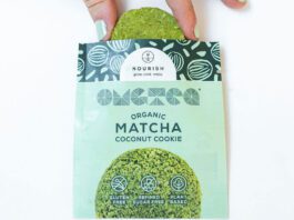 Nourish unveils new Matcha Coconut Cookies A person pulls a Nourish Matcha Coconut Cookie out form its packet.