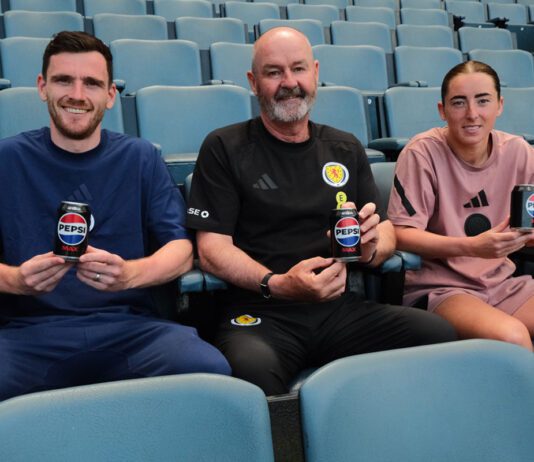 Pepsi Max kicks off new deal with Scotland football teams Scottish footballer Andy Robertson, Steve Clarke, head coach, and footballer Kathleen McGovern sit in Hampden Stadium seats holding cans of Pepsi Max.