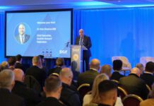 SGF highlights pressure on retailers at Mini Summit Pete Cheema, chief executive at the Scottish Grocers' Federation, delivers a talk from a podium during the SGF Mini Summit 2026.