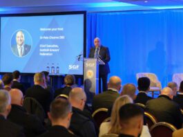SGF highlights pressure on retailers at Mini Summit Pete Cheema, chief executive at the Scottish Grocers' Federation, delivers a talk from a podium during the SGF Mini Summit 2026.