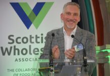 Scottish Wholesale Association highlights sector’s resilience Colin Smith, chief executive at the Scottish Wholesale Association, stands at a podium for the firm's annual conference 2026.