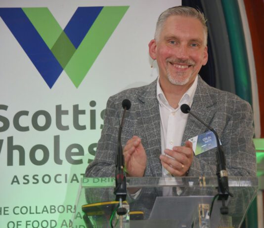 Scottish Wholesale Association highlights sector’s resilience Colin Smith, chief executive at the Scottish Wholesale Association, stands at a podium for the firm's annual conference 2026.