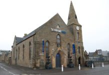 Scotmid moves into former Burghead church building Exterior image of Scotmid Burghead.