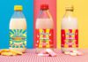 Delamere shakes up the market with Swizzels flavours Bottles of Delamere Swizzels flavoured milks stand against different coloured background with the Swizzels sweets in front of the bottles.