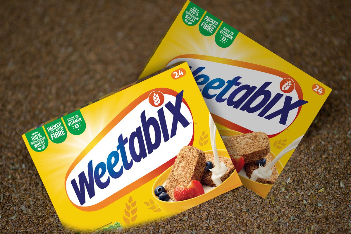 Boxes of Weetabix sit inside a pile of grain.