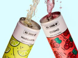 All Shook Up launches new cocktail cans Cans of All Shook Up Margarita and Cosmo are clinked together as the cocktails spill out the top of the cans against a blue background.
