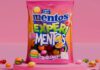 Mentos shakes up sharing segment with Experimentos A bag of Mentos Experimentos sits against a pink background with some of the sweets around the bag.