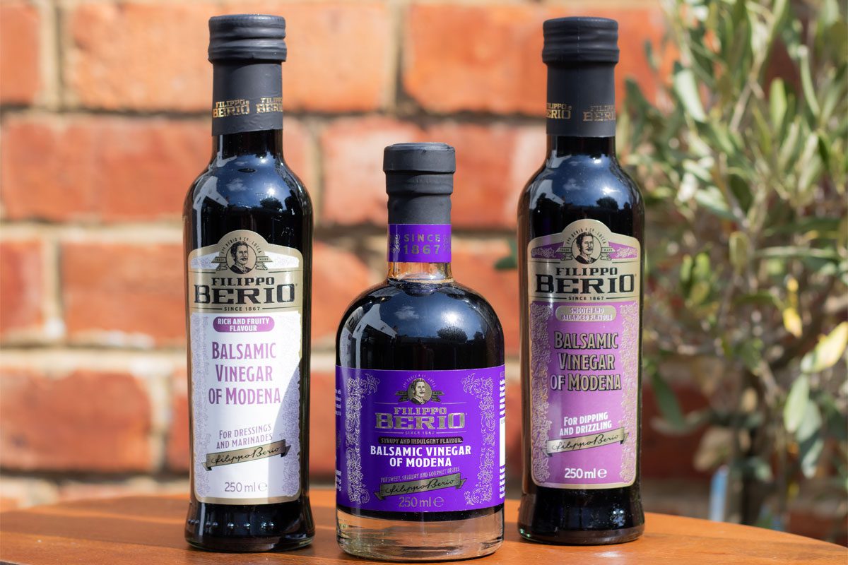 Bottles of Filippo Berio Balsamic Vinegar of Modena that are designed to suit different meals with notes on the bottles.