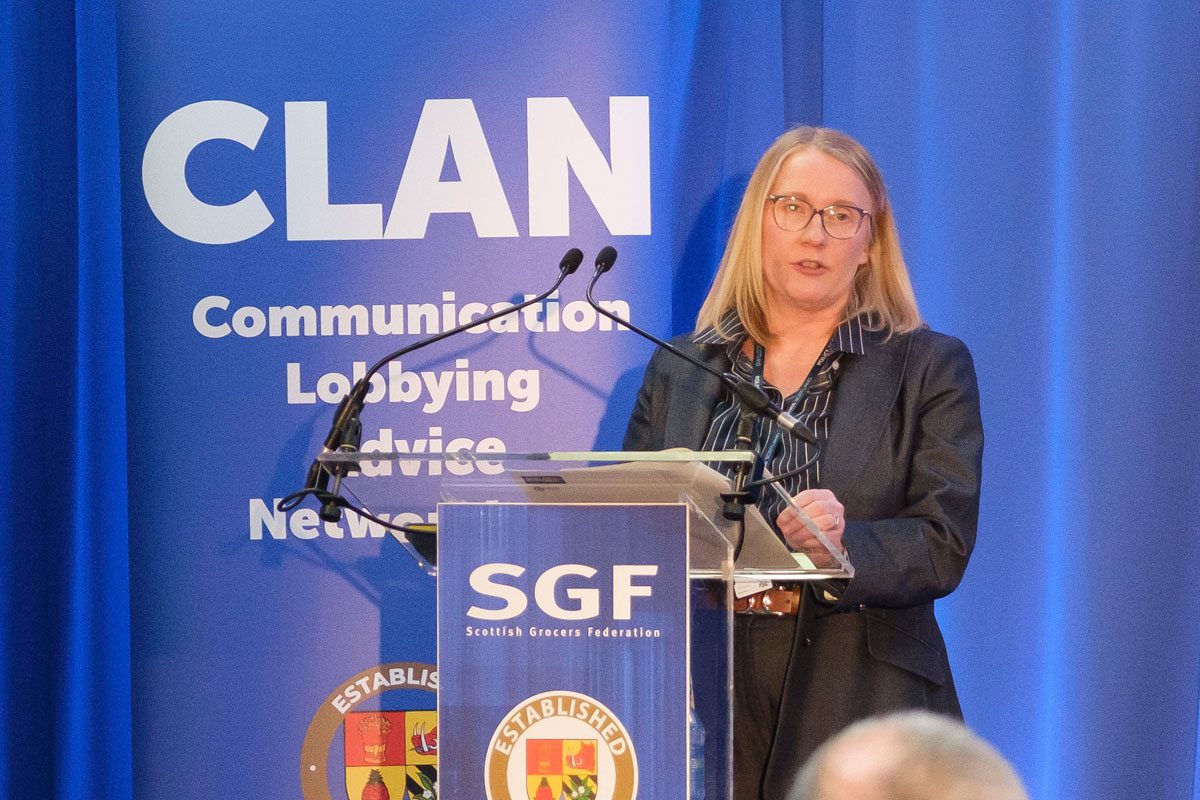 Police Inspector Emma Wright stands at a podium at the Scottish Grocers' Federation's Annual Crime Conference.
