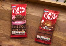 KitKat expands sharing bar range with two new flavours Packs of KitKat Sharing Bars Brownie and Milk Chocolate flavour sit on a wooden tray.