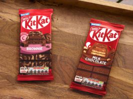 KitKat expands sharing bar range with two new flavours Packs of KitKat Sharing Bars Brownie and Milk Chocolate flavour sit on a wooden tray.