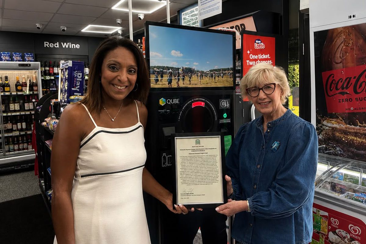 Nathalie Fullerton, store owner of Go Local Partick, stands with Patricia Ferguson MP in her store to receive an Early Day Motion commendation for her role in representing the sector.