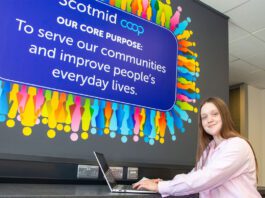 Scotmid marks International Intern Day Anna Lodge, Saltire Scholar, sits with a laptop in Scotmid HQ.