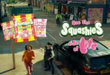 Swizzels pushes Squashies range in new TV ad campaign A still image from the 'See the Squashies side of life' ad campaign for Swizzels with a woman walking down a street with inflatable characters near her. Packs of Swizzels Squashies variants are also included in the imagery.