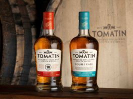 Tomatin expands listings across Booker locations Bottles of Tomatin 10 Year Old whisky and Tomatin Double Cask whisky stand in front of a wooden barrel with the Tomatin logo on it.
