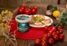 Yester Farm scoops up 3 star Great Taste Award A tub of Yester Farm Dairies Soft Cheese sits next to a plate with canapés on it and different foods around the plate.