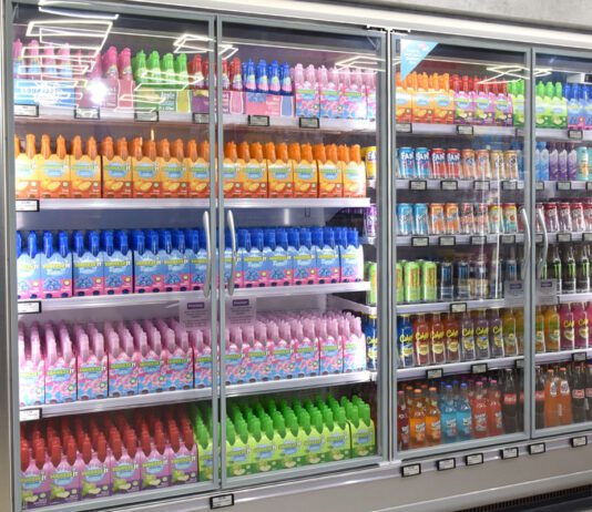 Energy costs push inflation back above 3% An image of a refrigerator unit inside a convenience store with soft drinks inside and doors on the chiller.
