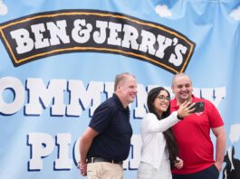 Chris Cobb wins UK-wide Ben & Jerry’s competition Chris Cobb, store owner of Cults Stores – KeyStore, stands with Ghayda Jameel, senior account exec at Cirkle, and Andrew Young, business development exec at The Magnum Ice Cream Company, stand together to take a selfie in front of the Ben & Jerry's Community Picnic banner.
