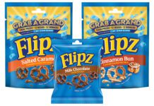 Flipz unveils new format and returning prize promo Pack shots of Flipz Milk Chocolate Singles 39g and Flipz Salted Caramel and Cinnamon Bun packs with the Grab a Grand promo across the packs.
