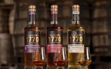 Glasgow 1770 rolls out Batch 2 whisky trio Bottles of Glasgow 1770 Batch 2 sit on a barrel with nosing glasses in front of them with samples of the whiskies inside. (L to R) Glasgow 1770 Sherry Cask Matured, Glasgow 1770 Ruby Port Cask Finish and Glasgow 1770 Bourbon Cask Matured.
