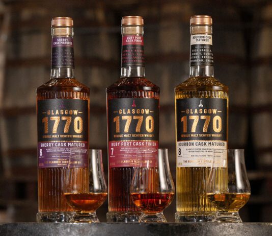 Glasgow 1770 rolls out Batch 2 whisky trio Bottles of Glasgow 1770 Batch 2 sit on a barrel with nosing glasses in front of them with samples of the whiskies inside. (L to R) Glasgow 1770 Sherry Cask Matured, Glasgow 1770 Ruby Port Cask Finish and Glasgow 1770 Bourbon Cask Matured.