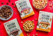 Popcorn Kitchen unveils Christmas gifting range Packs of Popcorn Kitchen Christmas gift packs lie across a red tabletop with bowls of the popcorn around them. The flavorus include White Choc & Raspberry, Double Choc Caramel Cookie and Gingerbread.