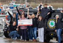 Spar Scotland donates £13k to local causes Paula Middleton, head of marketing at CJ Lang & Son, stands with the Cetacean Research & Rescue Unit holding a cheque for £10,000.