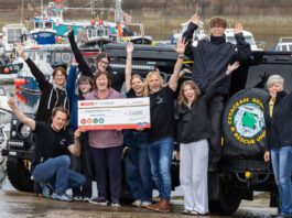 Spar Scotland donates £13k to local causes Paula Middleton, head of marketing at CJ Lang & Son, stands with the Cetacean Research & Rescue Unit holding a cheque for £10,000.