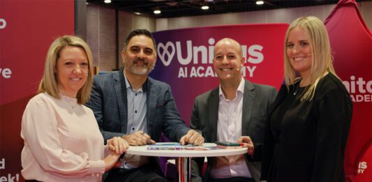 Promo delivers sales uplift for Unitas members (L to R) Ashleigh Cheetham, Gurms Athwal, David Cooke and Belinda Parkinson sit together at a table during the Unitas trade exhibition.