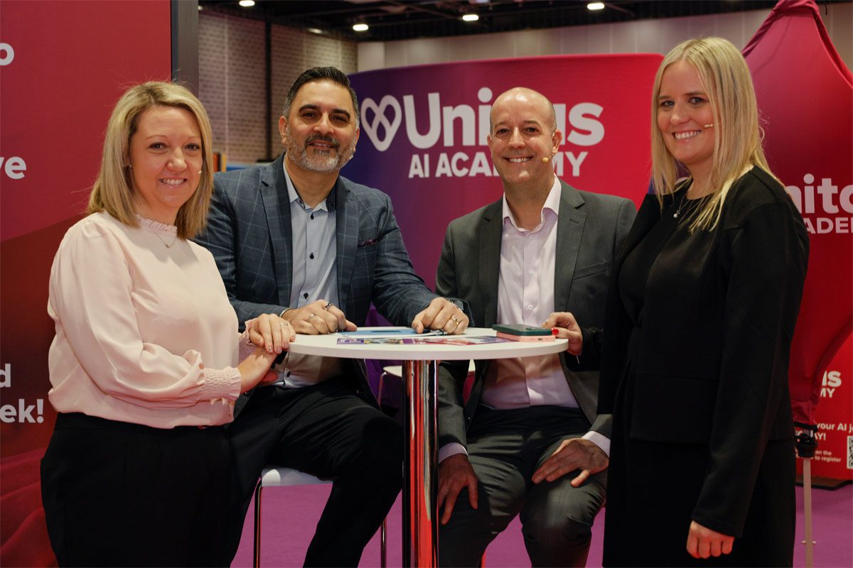 (L to R) Ashleigh Cheetham, Gurms Athwal, David Cooke and Belinda Parkinson sit together at a table during the Unitas trade exhibition.