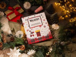 Walker’s Shortbread Advent Calendar returns for 2026 A Walker's Shortbread Advent Calendar sits in the middle of a Christmas scene with presents, decorations and lights.