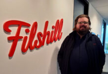 Filshill develops talent with new promotions Scott Sutherland, regional development manager at JW Filshill, stands next to the Filshill logo at the company's offices.