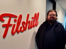 Filshill develops talent with new promotions Scott Sutherland, regional development manager at JW Filshill, stands next to the Filshill logo at the company's offices.