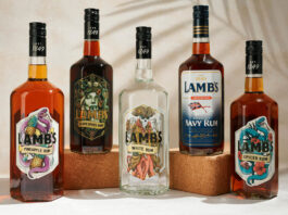 LMB UK secures Lamb’s Rum range Bottles of Lamb's Rum variants sit against a white background with palm leaf shadows over them.