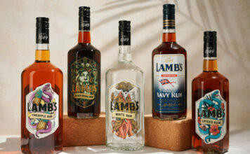 LMB UK secures Lamb’s Rum range Bottles of Lamb's Rum variants sit against a white background with palm leaf shadows over them.