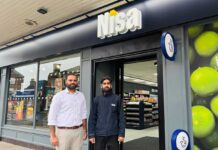 New-look Nisa store for Scotland From left, owner Zaib Bal with Abdullah Bhatti outside the new Nisa Troon that gives local shoppers access to Co-op brand products.