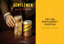 Schweppes kicks off festive sales with Netflix’s The Gentlemen Promotional image for the collaboration between Schweppes and Netflix's The Gentlemen featuring a hand reaching for a cocktail serve with a can of Schewppes Indian Tonic Water next to it. The advert invites consumers to "Try The Gentlemen's Cocktail" on the right-hand side of the image.