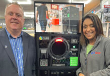 Nathalie Fullerton highlights retailer issues to local MSP Bob Doris SNP MSP stands in Go Local Partick with owner Nathalie Fullerton next to the TROVR QUBE RVM.