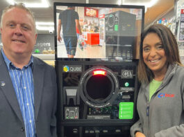 Nathalie Fullerton highlights retailer issues to local MSP Bob Doris SNP MSP stands in Go Local Partick with owner Nathalie Fullerton next to the TROVR QUBE RVM.