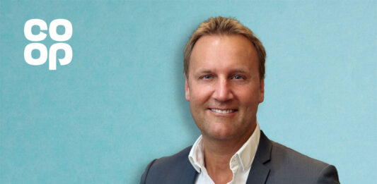 Co-op Retail appoints new managing director Head shot of Alex Dower, managing director of Co-op Retail. The Co-op logo is in the top left hand corner against a blue background.