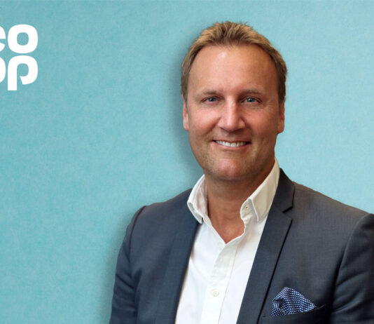 Co-op Retail appoints new managing director Head shot of Alex Dower, managing director of Co-op Retail. The Co-op logo is in the top left hand corner against a blue background.