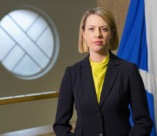 Industry calls on ScotGov to act before rates soar out of control Jenny Gilruth, deputy First Minister of the Scottish Government, stands in Parliament with the Scotland flag behind her.