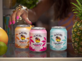 Malibu doubles down on RTDs with new Malibu Punch range Cans of Malibu Punch sit on a bar as a person's hand reaches for them. There is also different pieces of fruit across the bar.