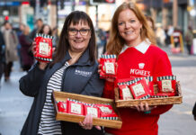 McGhee’s teams up with Brodies to save the tea break Mina MacKenzie, retail partner manager at Brodies, and Aisling McGhee, commercial director at McGhee's, stand outside Glasgow Central Station holding packs of McGhee's individual biscuits with Brodies tea bag attached to it. Each also hold a wicker basket with more biscuit and tea combos.